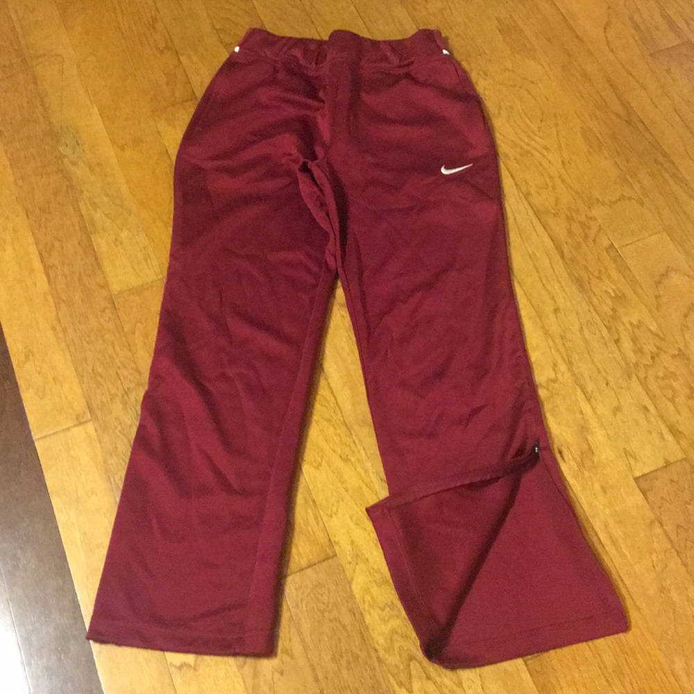 Maroon Nike athletic pants